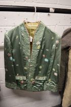 A Ladies Chinese embroidered cream satin jacket.