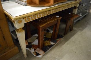 Painted table, two stools and a piece of marble.