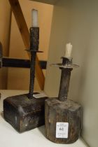Two rustic candle holders.