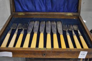 A cased set of fish knives and forks.