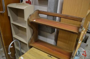 A painted bookcase and pine shelves.