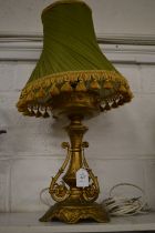 An ormolu table lamp.
