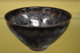 A Chinese mottle glazed small circular bowl.