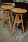 A pair of adjustable bar stools.