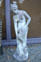 A reconstituted stone garden statue modelled as the bather.