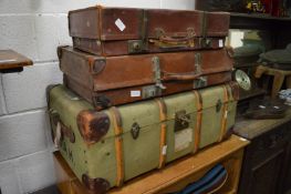 Two old suitcases and a trunk.