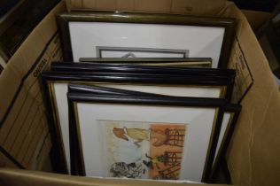 A box of assorted paintings and prints.