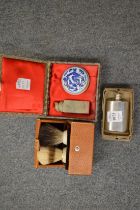 A miniature hip flask, Chinese seal, boxed and two shaving brushes in a leather case.