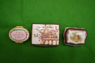 Three enamel pill boxes.