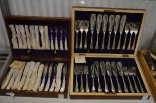 A cased set of mother of pearl handled dessert knives and forks together with a cased set of fish