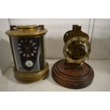 A reproduction brass carriage clock and a clock movement.
