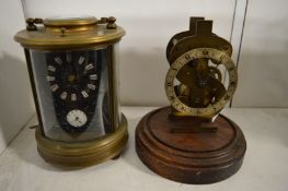 A reproduction brass carriage clock and a clock movement.