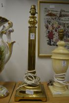 A brass table lamp.