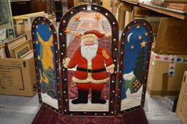 A Christmas folding fire screen.