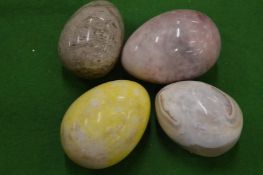 Four hard stone eggs.