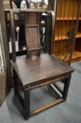 A Chinese small softwood chair with carved back panel.