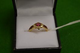An unusual gold ruby and diamond ring.