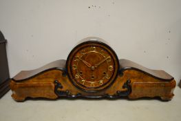 A stylish walnut cased mantel clock.