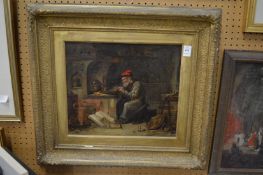 A 19th century English school, figure in a workshop, oil on canvas in a decorative gilt frame.