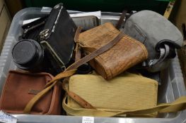 A quantity of cameras and camera equipment.