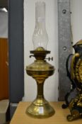A brass oil lamp.
