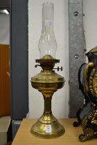 A brass oil lamp.