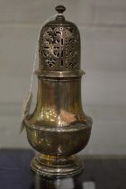 A pedestal sugar castor with engraved crest.