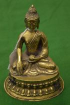 A brass buddha.