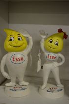 A pair of cast iron Esso figures.