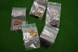 Various packets of colourful stones.