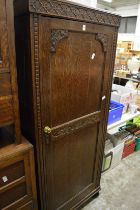 An oak single door wardrobe.