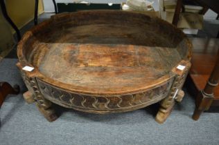 An Eastern carved hardwood circular feeding bowl.