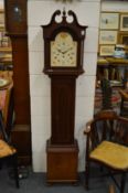 A reproduction mahogany grandmother clock.