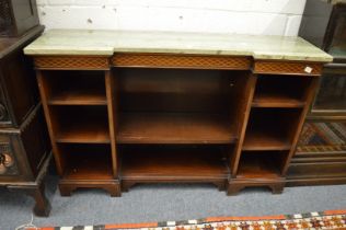 A Regency style inlaid mahogany and marble top inverted break front low bookcase.
