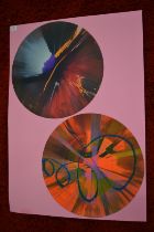 In the manner of Damien Hirst, A pair of circular spin paintings, mounted but unframed.