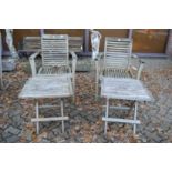 A pair of hardwood garden armchairs and a pair of folding occasional tables.