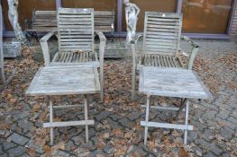 A pair of hardwood garden armchairs and a pair of folding occasional tables.