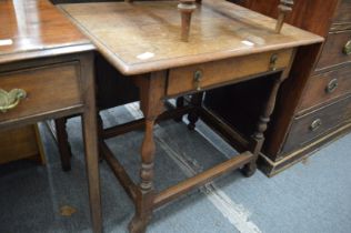 An oak single drawer side table.