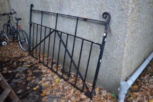 A large wrought iron gate.