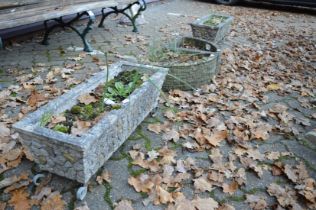 Two pairs of reconstituted stone garden troughs.