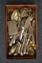 A collection of silver flatware and other items.