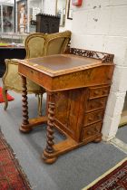 A Victorian figured walnut Davenport.