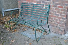 A Regency style wrought iron garden bench.