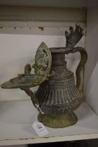 An Indian metal ewer/oil lamp.