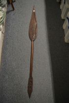 An African carved wood paddle style spear.