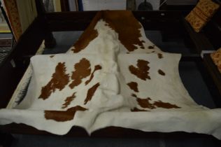 A cow skin rug.