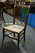 An Edwardian inlaid mahogany spindle back occasional chair.