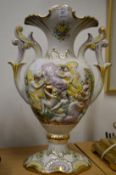 A decorative twin handled vase.