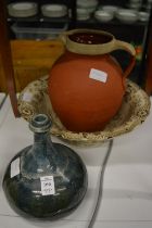 Stoneware bottle, terracotta jug and a bowl.
