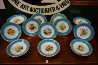 A Minton part dessert service, gilt and turquoise borders, the centres decorated with fruit, birds